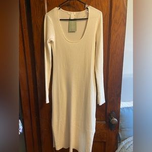 White ribbed midi dress with split sleeves.